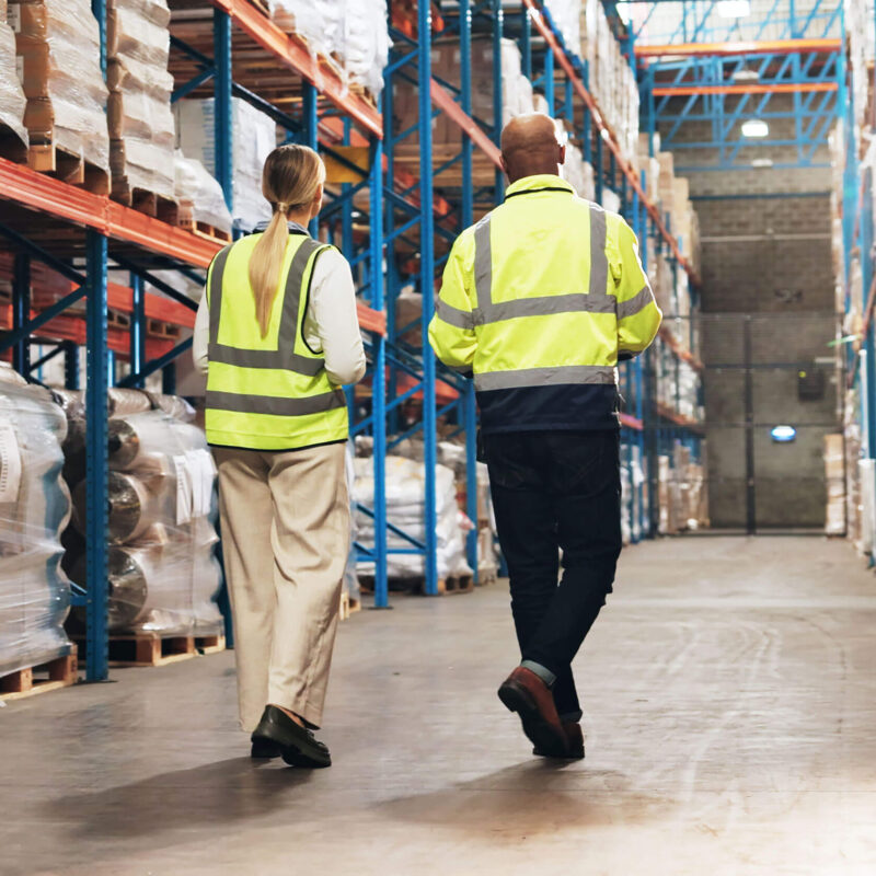 Warehouse workers walking